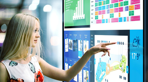 Girl pointing at LCD display panel